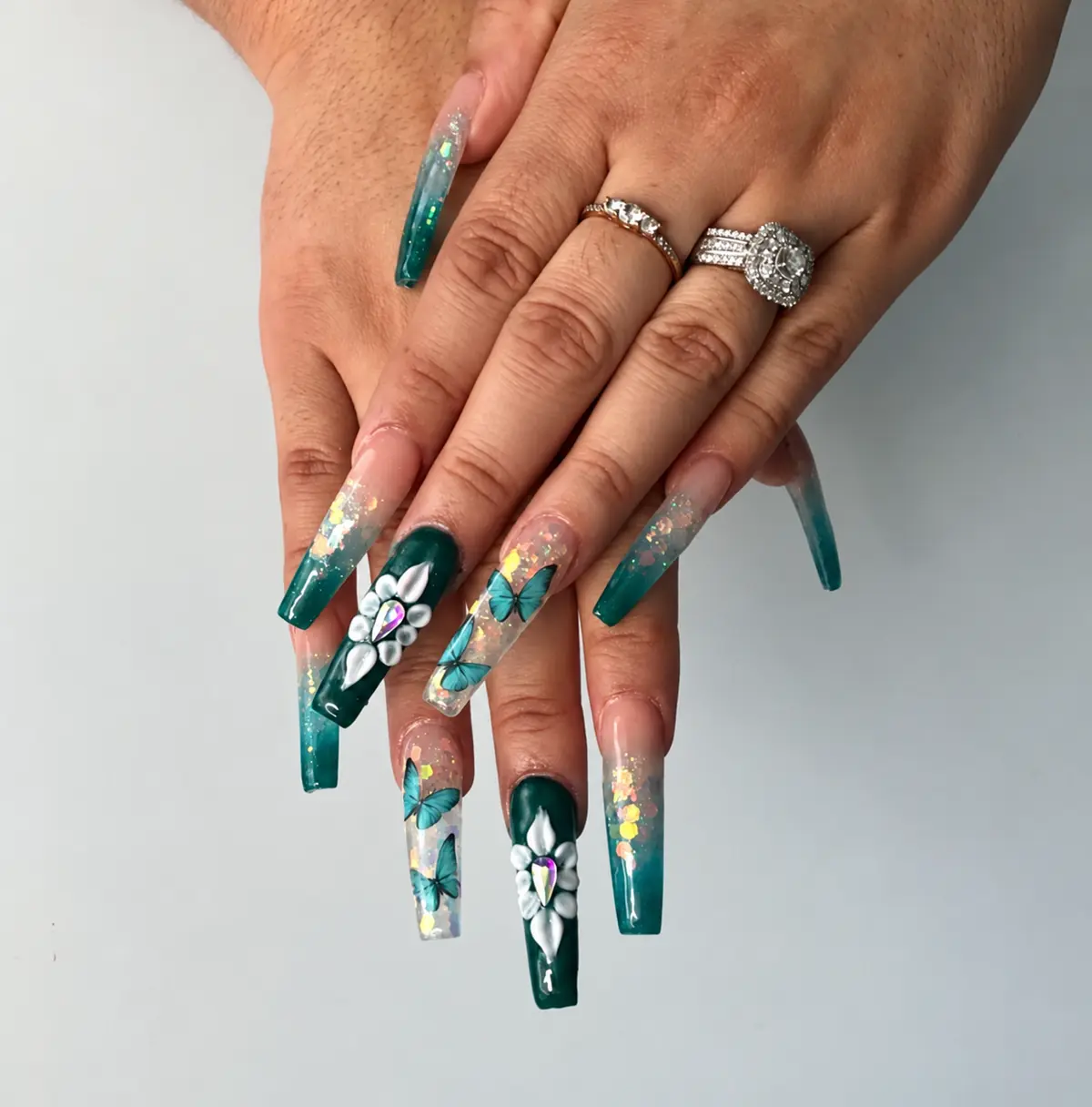 Emerald square nails with butterfly art, gold flakes and white flowers