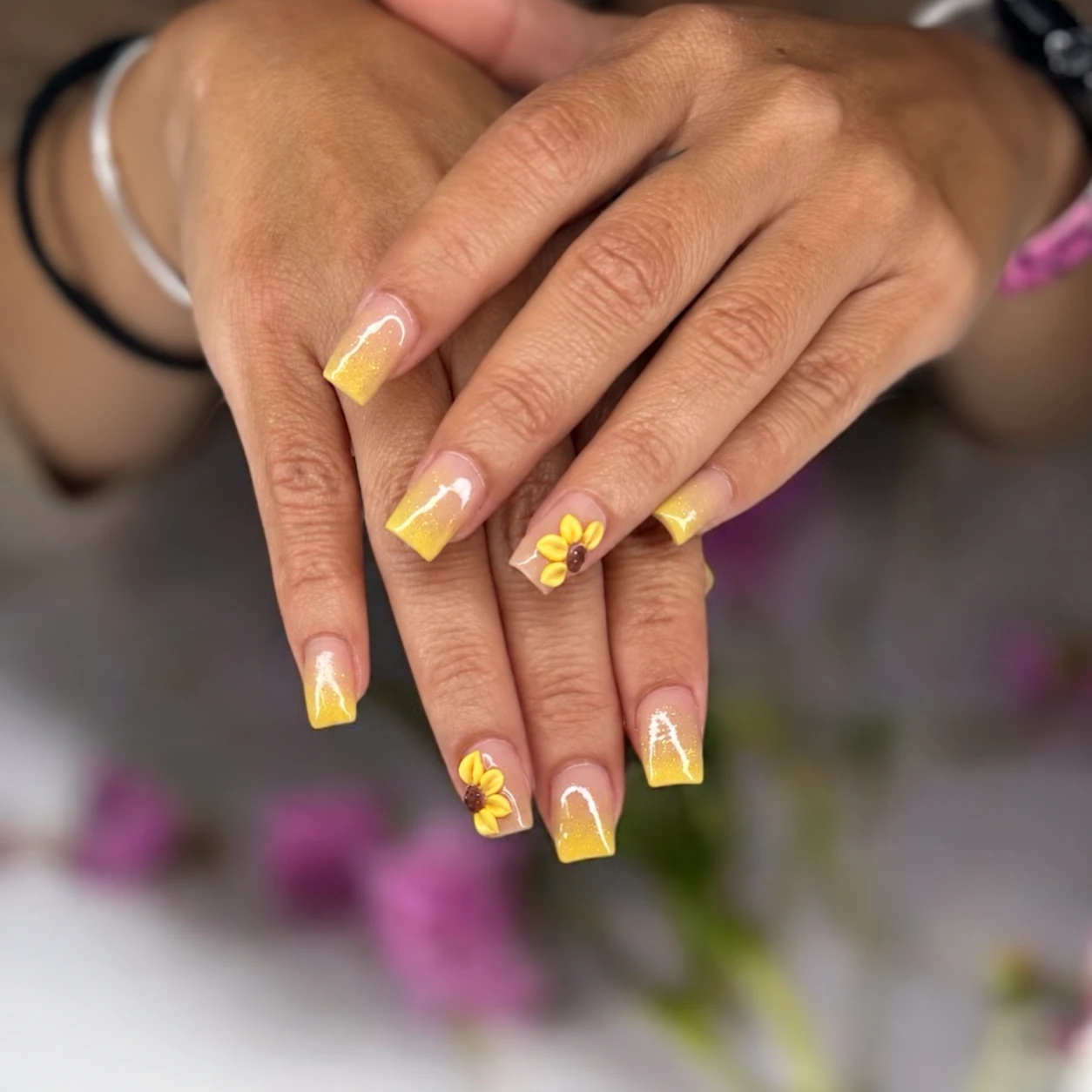 Yellow French tips with sunflower nail art
